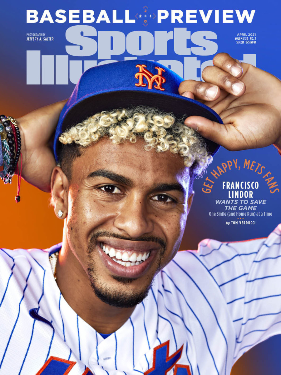Francisco Lindor poses with his new Mets hat